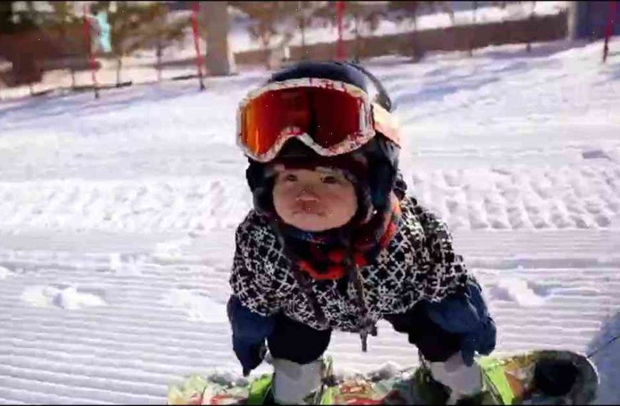 Seven months, five minutes and counting: how a baby snowboarder is learning tricks